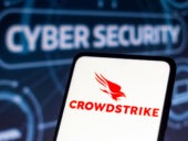 Logo of CrowdStrike displayed on a smartphone with the word Cybersecurity in the background.