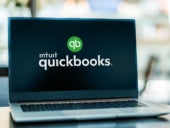 Laptop computer displaying logo of QuickBooks.