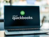 Laptop computer displaying logo of QuickBooks.