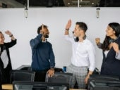 Stock photo of happy call center workers.